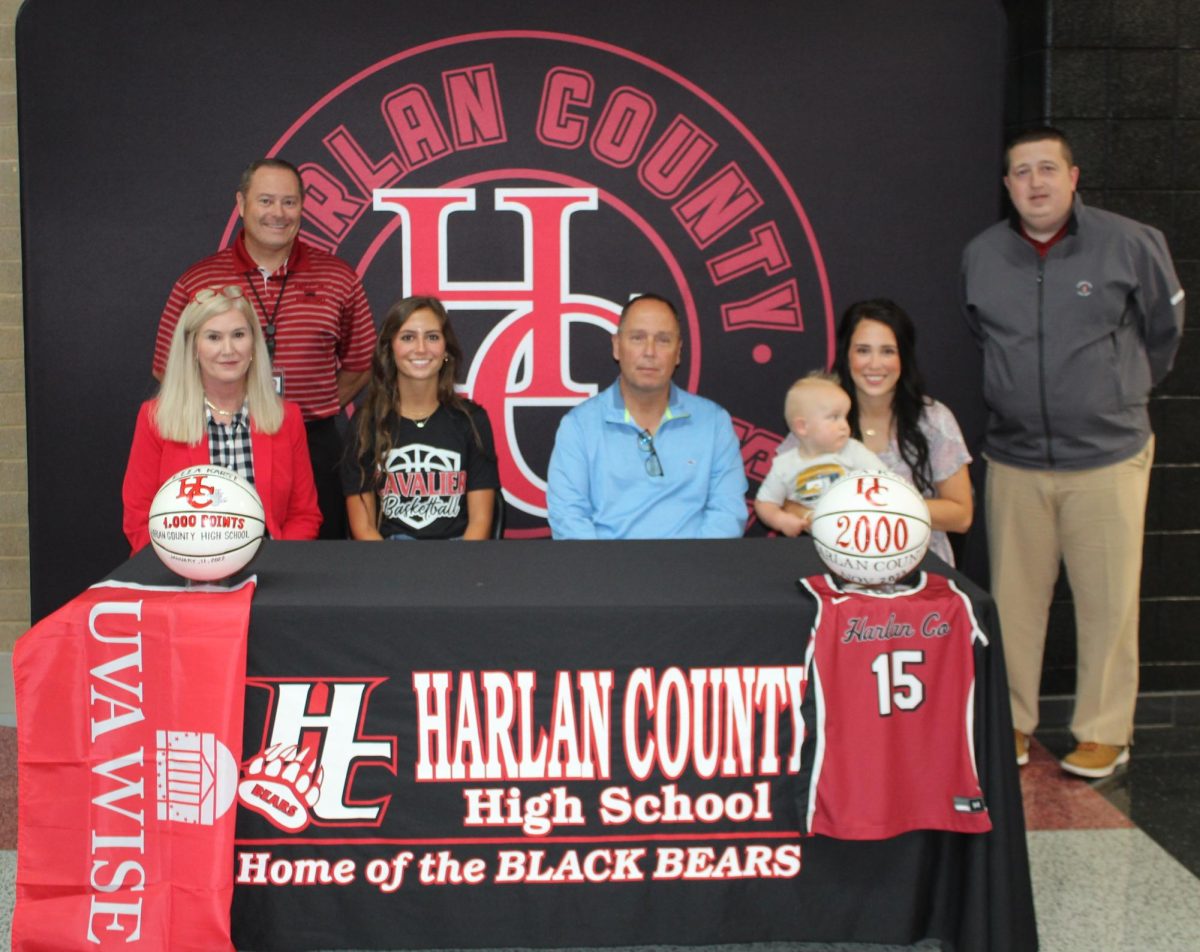 Harlan+County+senior+guard+Ella+Karst+signed+with+the+University+of+Virginia-Wise+on+Tuesday+in+a+ceremony+at+HCHS.+Pictured+with+Karst+are+her+parents%2C+Jane+and+David+Karst%2C+and+her+sister%2C+Anna+Spurlock+and+nephew%2C+Jacob%2C+along+with+coach+Anthony+Nolan+and+HCHS+athletic+director+Eugene+Farmer.