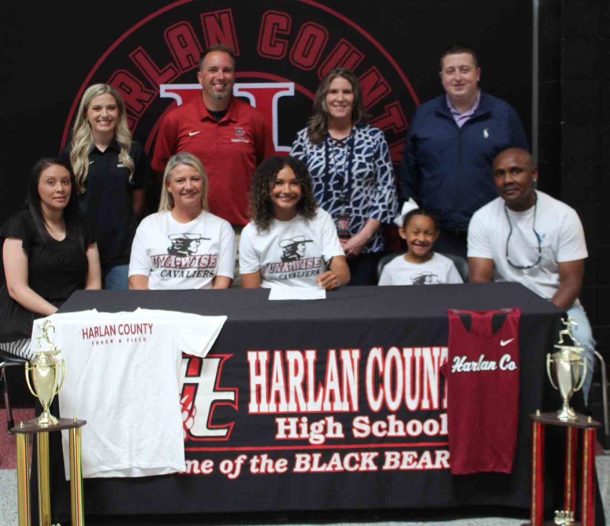 Harlan County senior Paige Phillips with the University of Virginia-Wise to continue her athletic and academic career. Pictured with Phillips are, from left, front row: and Jerry Phillips; back row: assistant coach Abby Vitatoe, coach Ryan Vitatoe, HCHS Principal Kathy Napier and athletic director Eugene Farmer.