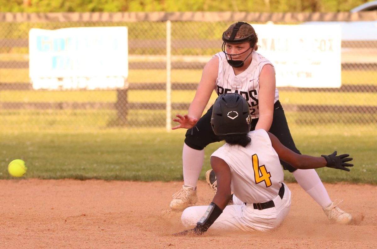 Middlesboros Keevi Betts was safe on a steal attempt in the fifth inning of Thursdays district clash as Harlan County second baseman Lindsey Skidmore awaited the throw.