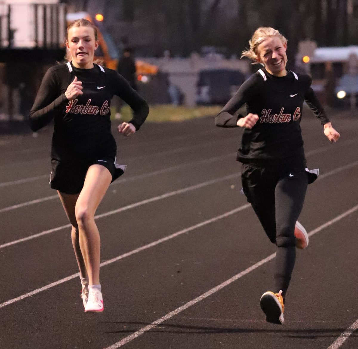 Lauren Lewis (left) will represent Harlan County in three races this weekend at the 2A state meet while Peyton Lunsford will compete in four events.