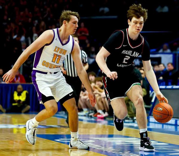 Harlan County guard brought the ball down the court against Lyon Countys Travis Perry in the state championship game last month. Both Noah and Perry, the states top two players in the Class of 2024, will play at the University of Kentucky next season.