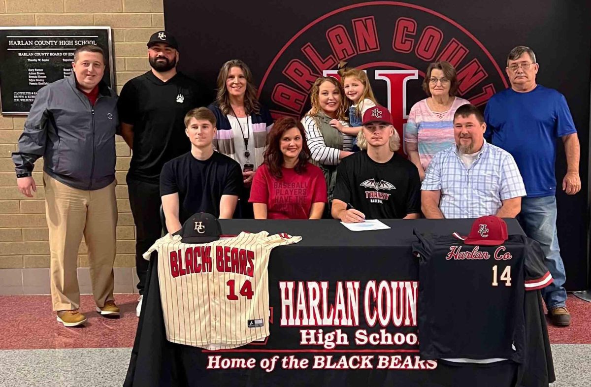 Harlan County senior Tristan Cooper signed recently with Transylvania University to continue his baseball and academic career. Pictured with Cooper are, from left, front row: Sean Cooper, Jennifer Shepherd and Donnie Cooper; back row: HCHS athletic director Eugene Farmer, HCHS baseball coach Scotty Bailey, Dottie Cooper, Emma Cooper, Rhonda Cooper and Donald Cooper.