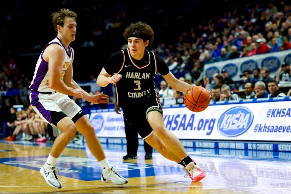 Harlan County all-state guard Maddox Huff, pictured in action against Lyon Countys Travis Perry in last years state championship game, recently picked up his third Division I offer from Youngstown State and then his fourth from UT-Martin.