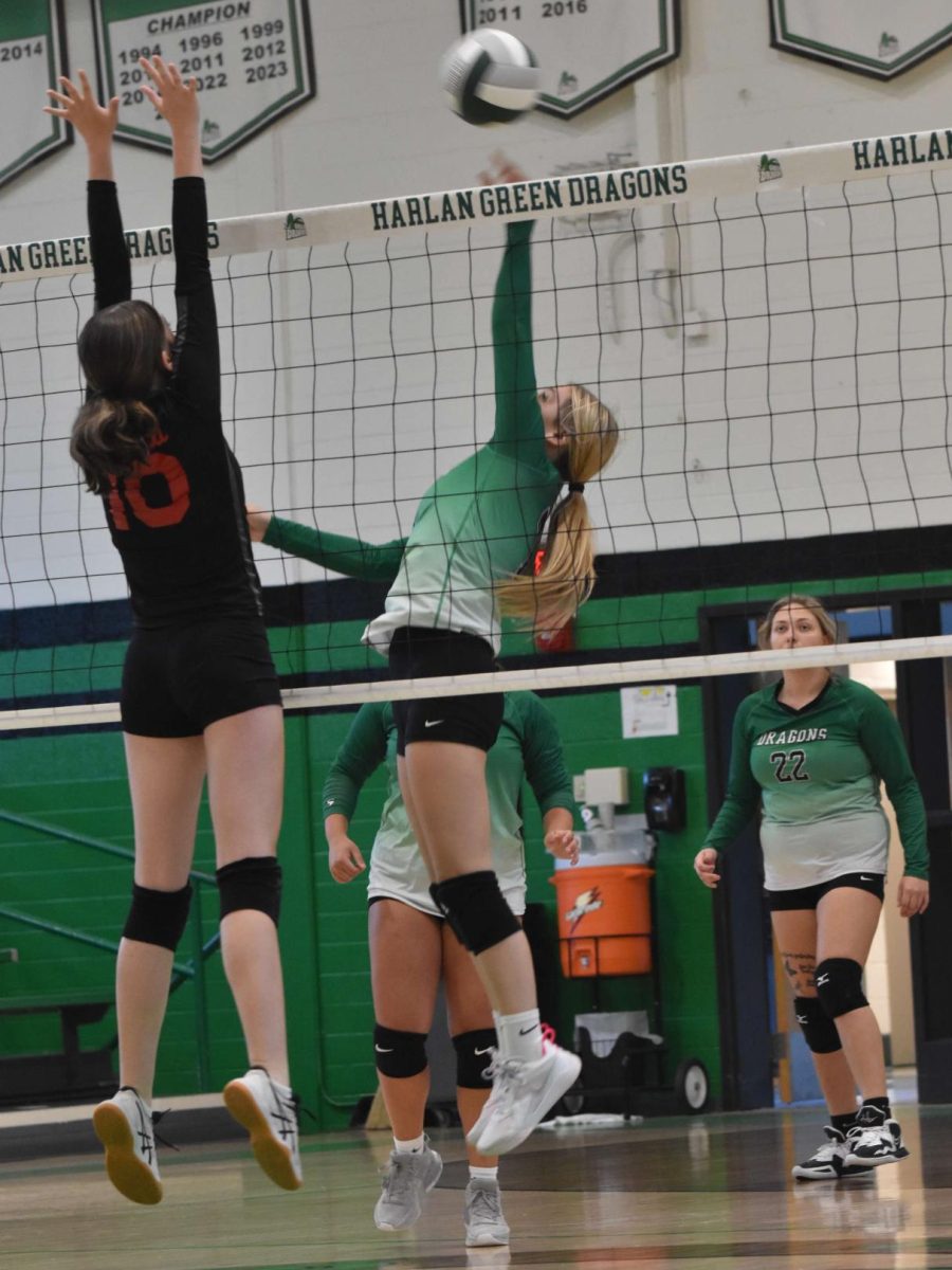 Harlan's Kaylee Roark went up at the net for one of her eight kills on Thursday in the Lady Dragons' four-set win over visiting Red Bird.