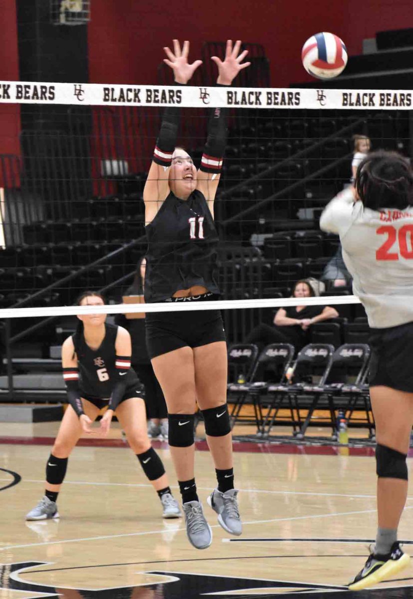 Harlan County junior Kylee Hoiska went to the net for a block in Monday's season-opening win over visiting SoutH Laurel.