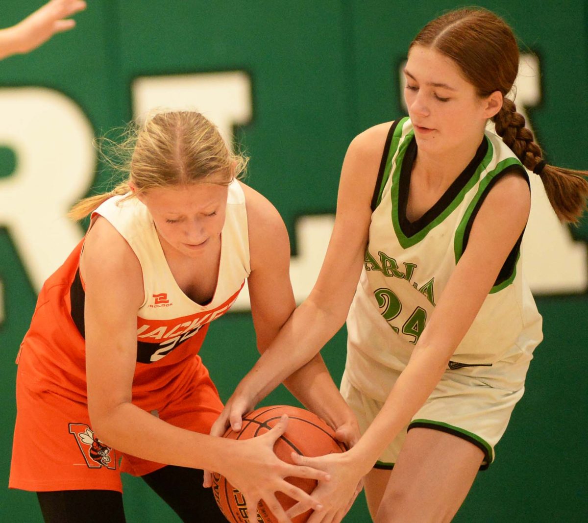 Harlan's Chrissy Saylor battled for possession in Thursday's middle school game against Williamsburg. The Lady Dragons rolled to a 35-17 victory.