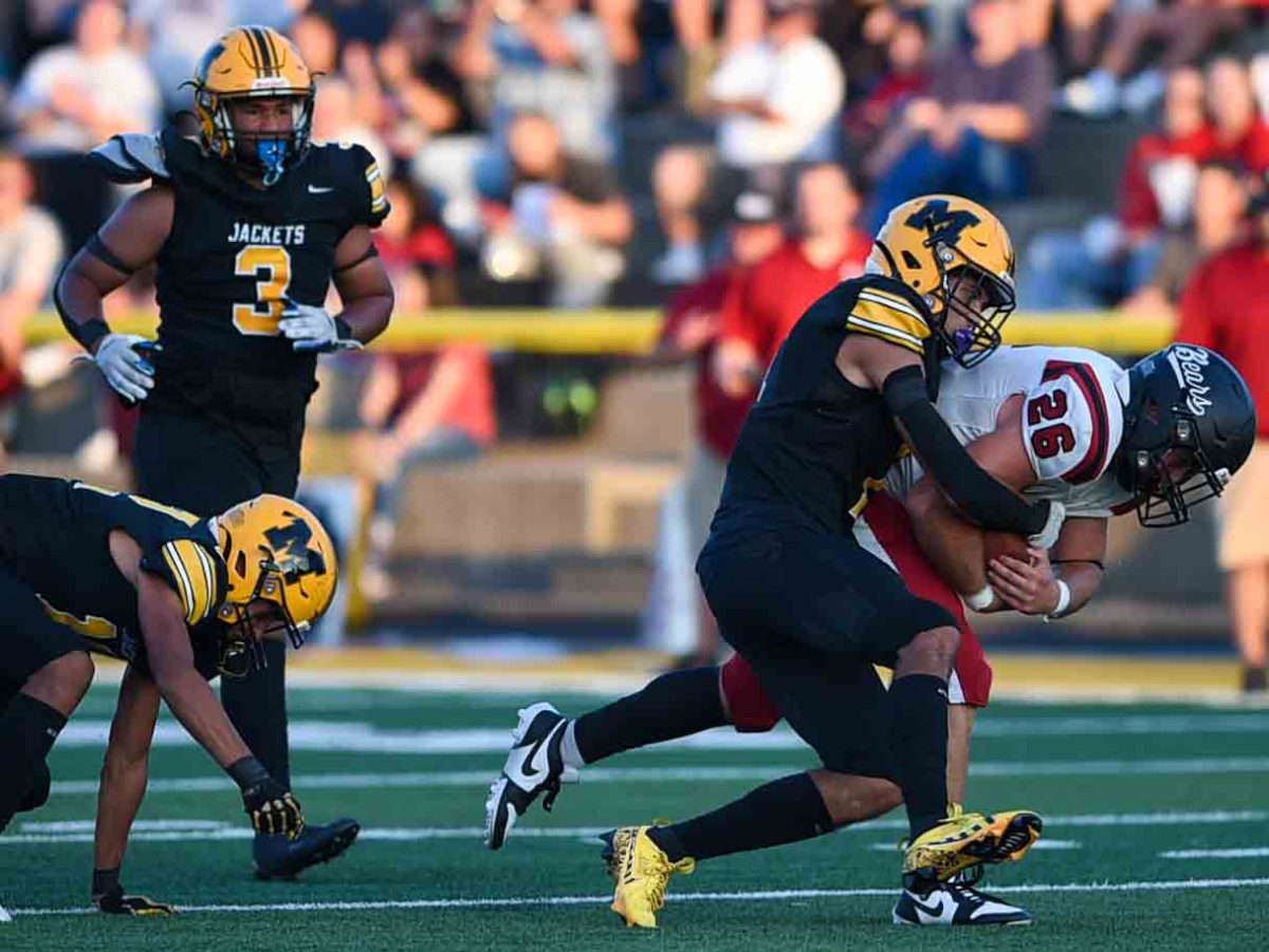 Harlan County senior fullback James Ryan Howard battled for extra yards in Friday’s game at Middlesboro. Howard ran for 180 yards and three touchdowns to lead the Black Bears to a 25-7 victory.