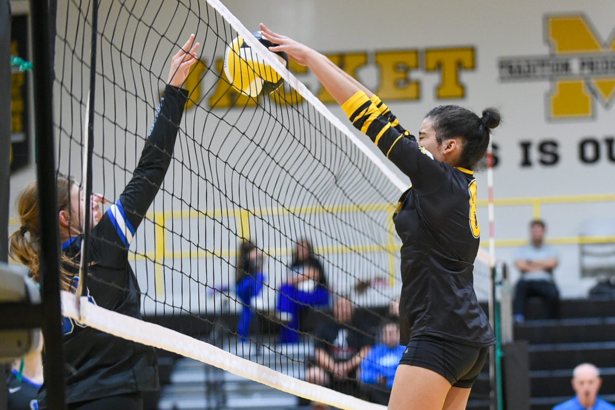 Middlesboro’s Leah Spencer went to the net against Bell County’s Gracie Barton in a district clash Thursday.