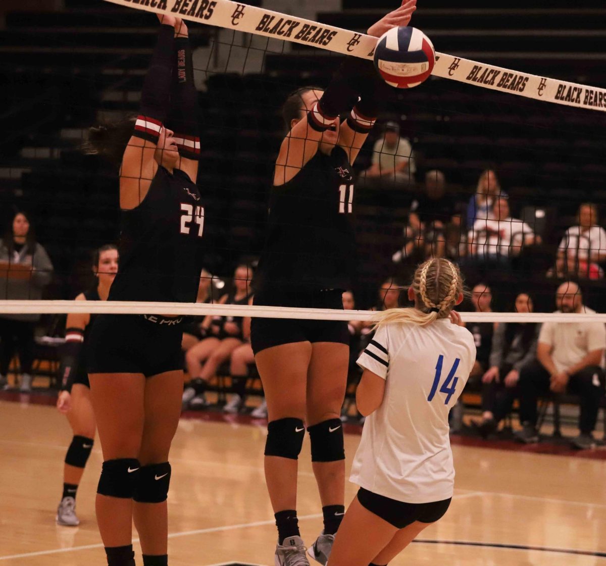 Harlan County's Madilynn Nolan (24) and Kylee Hoiska went to the net for one of several blocks in the second set of the Lady Bears' 25-13, 25-6, 25-11 win over visiting Barbourville.