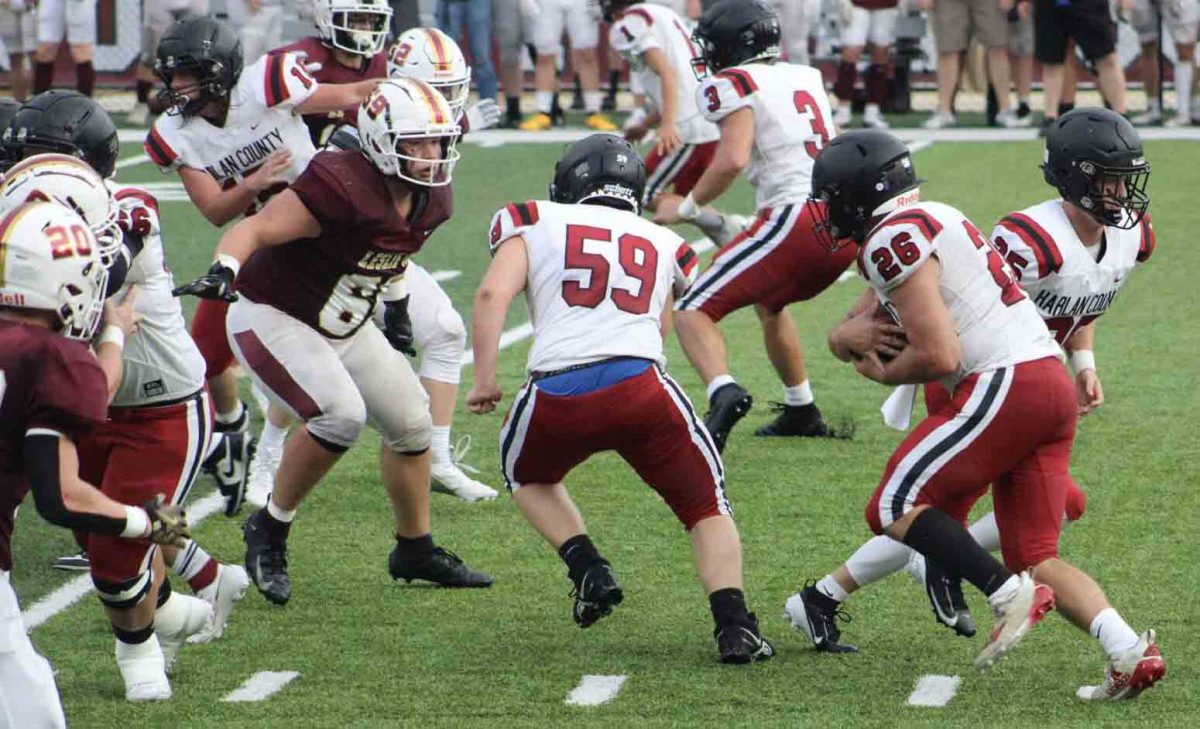 Harlan County senior fullback James Ryan Howard took a handoff from quarterback Brayden Morris in scrimmage action Friday at Leslie County. Morris scored two touchdowns in the Bears' 21-7 win.