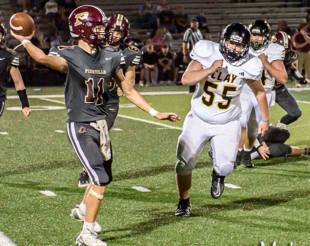 Pineville’s Jonathan Slone released a pass as the Clay County defense applied pressure in Friday’s game at Union Commonwealth University. The Tigers raced to an early 24-0 lead on the way to a 56-14 victory. The Mountain Lions return to action Friday against Rockcastle County.