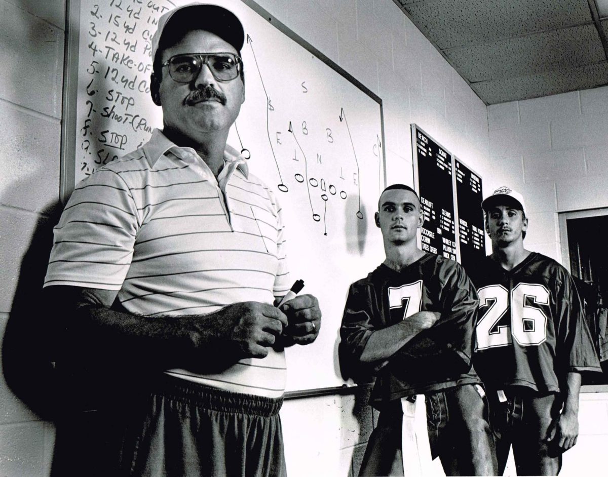 Tim Saylor is pictured before his last season of coaching at Cawood High School in 1994. His quarterback that season was his son, Jacob (7), and his top receiver was Brett Johnson (26). All three are on the current Harlan County coaching staff.