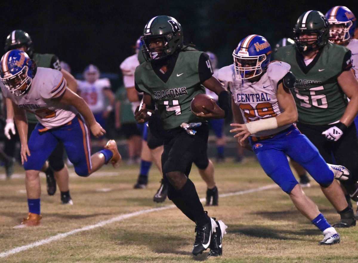 Harlan running back Sedrick Washington tried to get outside in action Friday against Pike Central. The visiting Hawks held Harlan to 40 yards rushing in the first three quarters on the way to a 34-8 win.