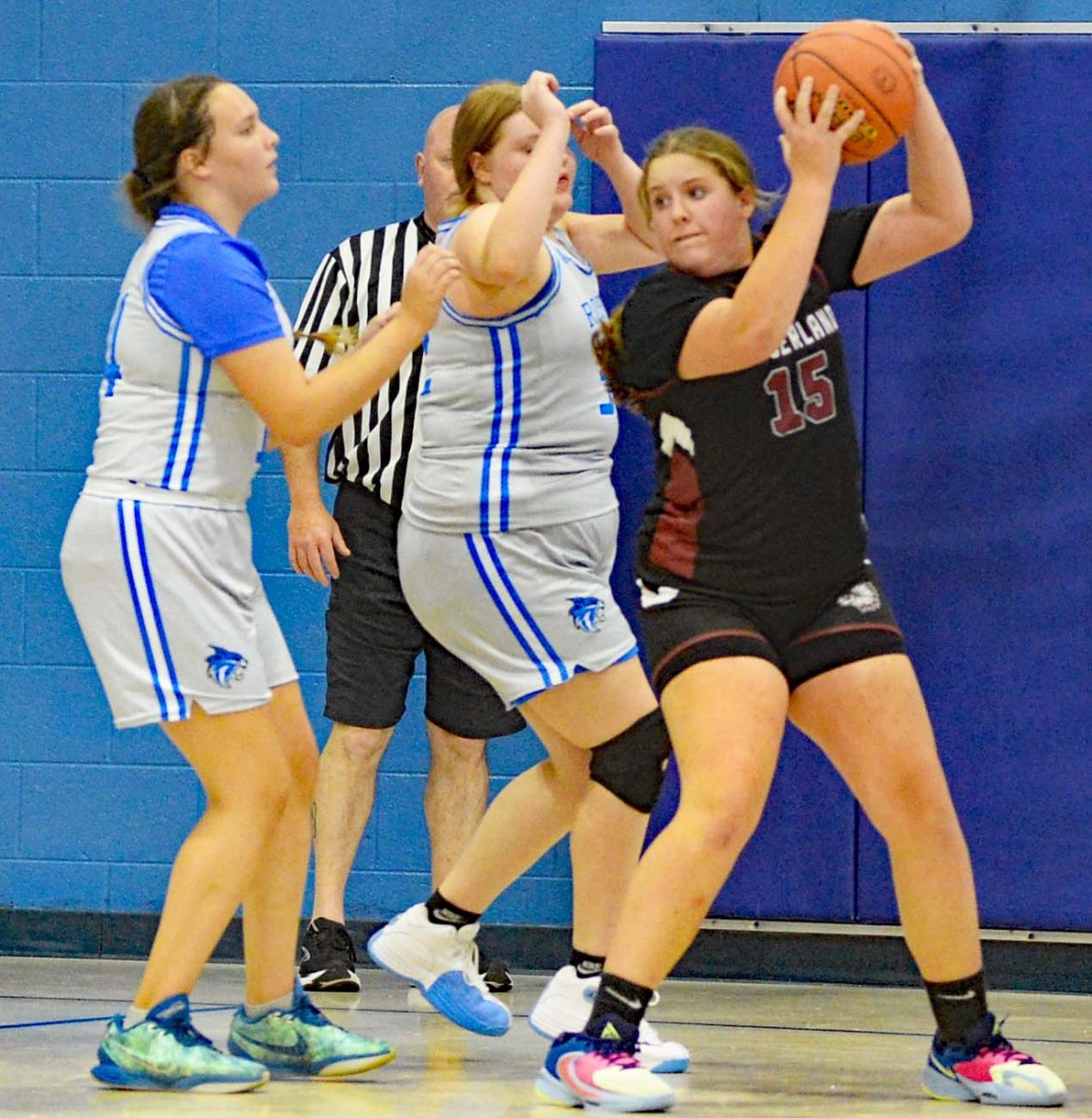 Rosspoint's Crissalyn Jones and Barbara Osborne double teamed Cumberland forward Lilly Scott in middle basketball action Thursday. The Lady Cats won 47-13.