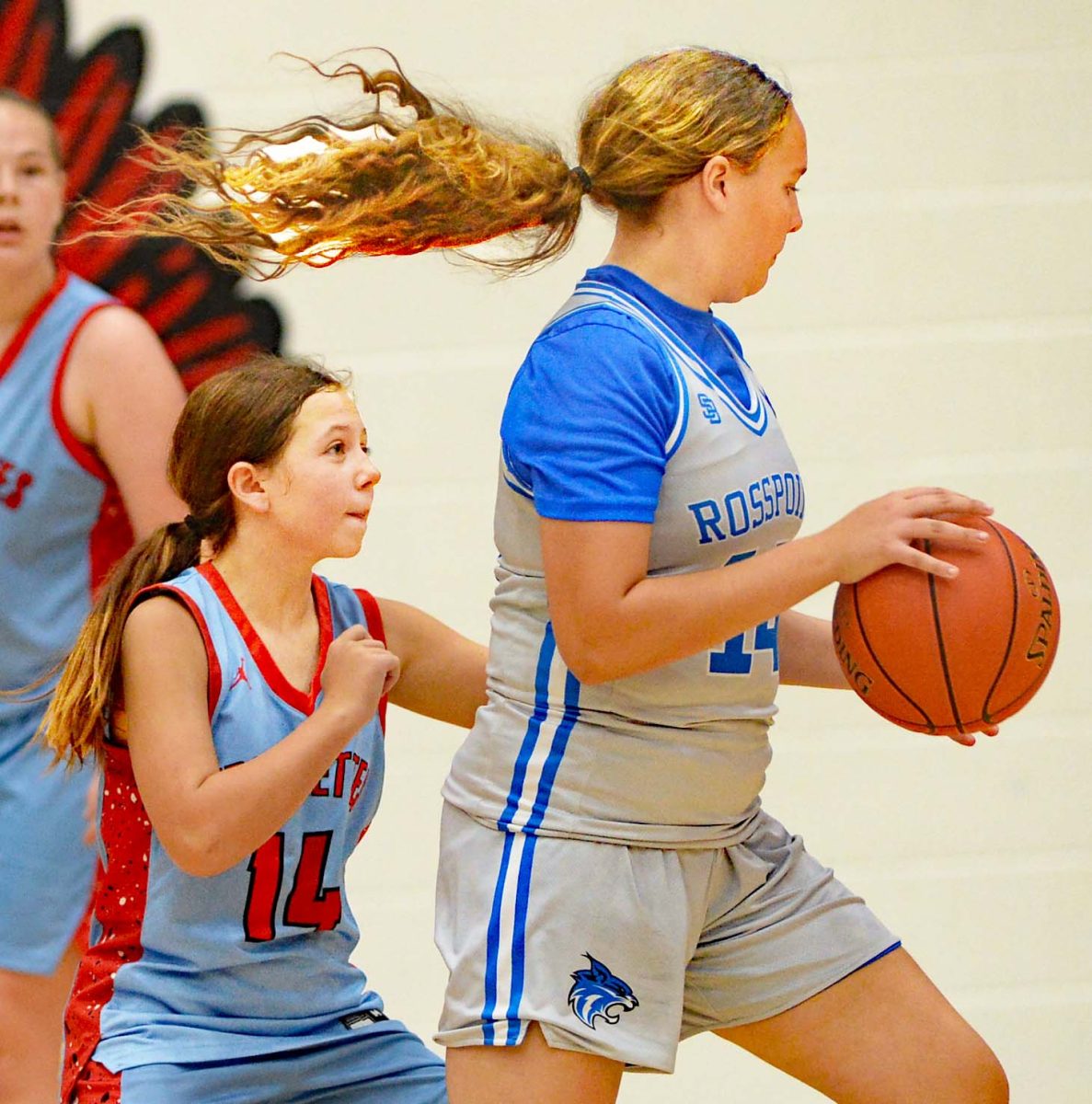 Rosspoint's Crissalyn Jones worked to the basket as James A. Cawood's CIdda Middleton defended in action last week. Jones scored 12 point Monday in teh Lady Cats win at Black Mountain.