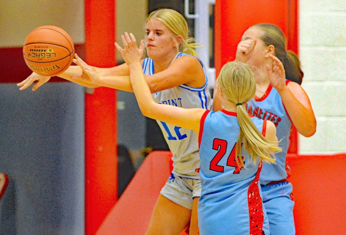 Rosspoint center Shasta Brackett made an outlet pass during middle school basketball action Tuesday at James A. Cawood Elementary School. Brackett scored 10 points in the Lady Cats' 47-8 victory.