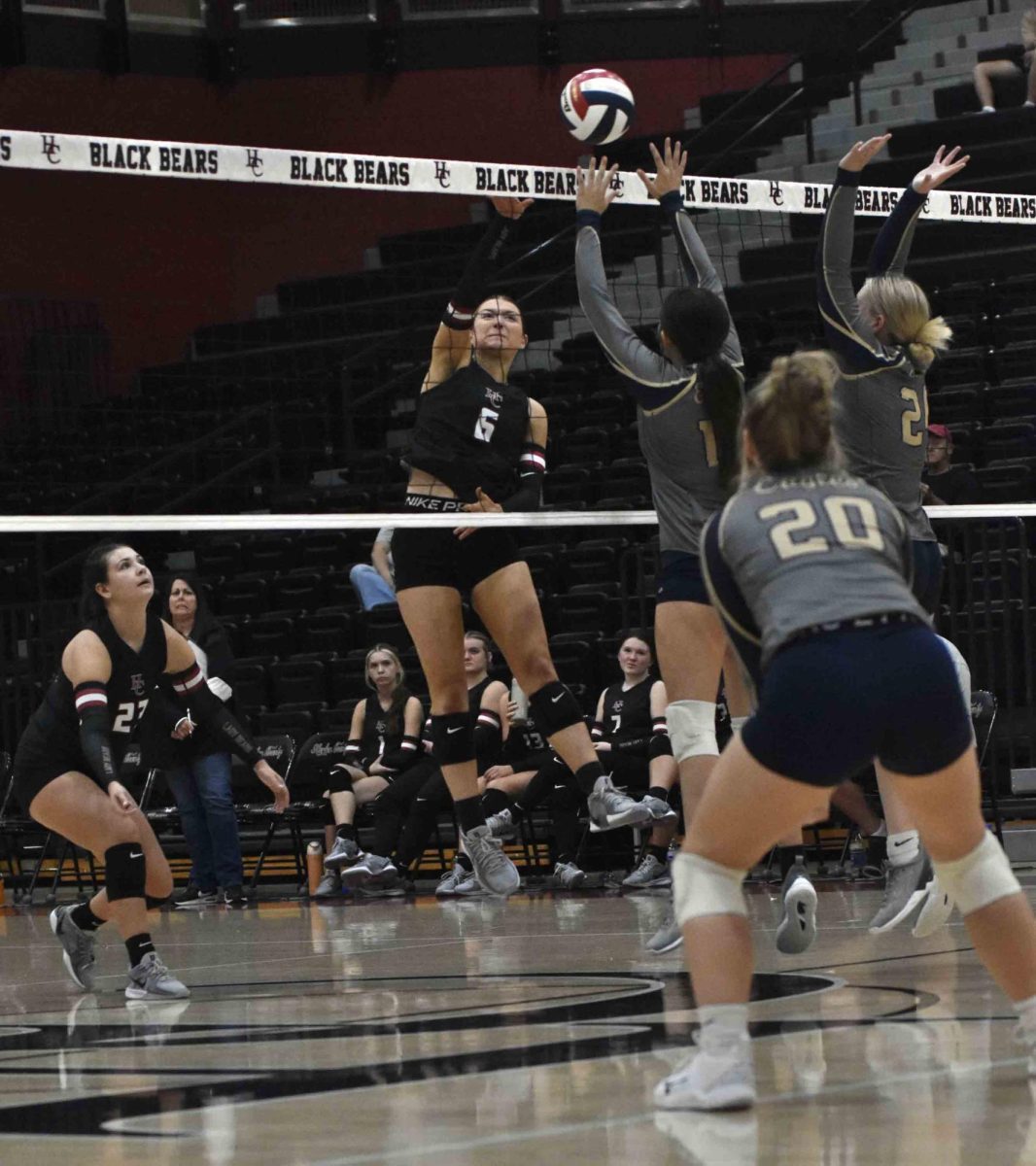 Harlan County junior Kalista Dunn went airborne to finish off a point during Saturday's four-set win over visiting Rye Cove, Va.