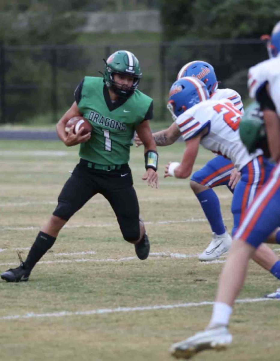 Harlan’s Baylor Varner round running room in Friday’s game against Pike Central. Varner ran for 85 yards in the loss.