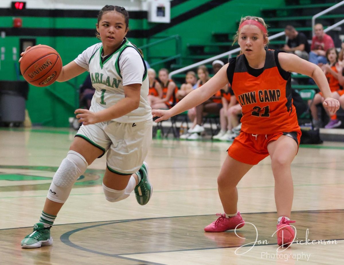 Harlan's JaLynn Pennington drove around a Lynn Camp defender during the Lady Dragons' win Monday.