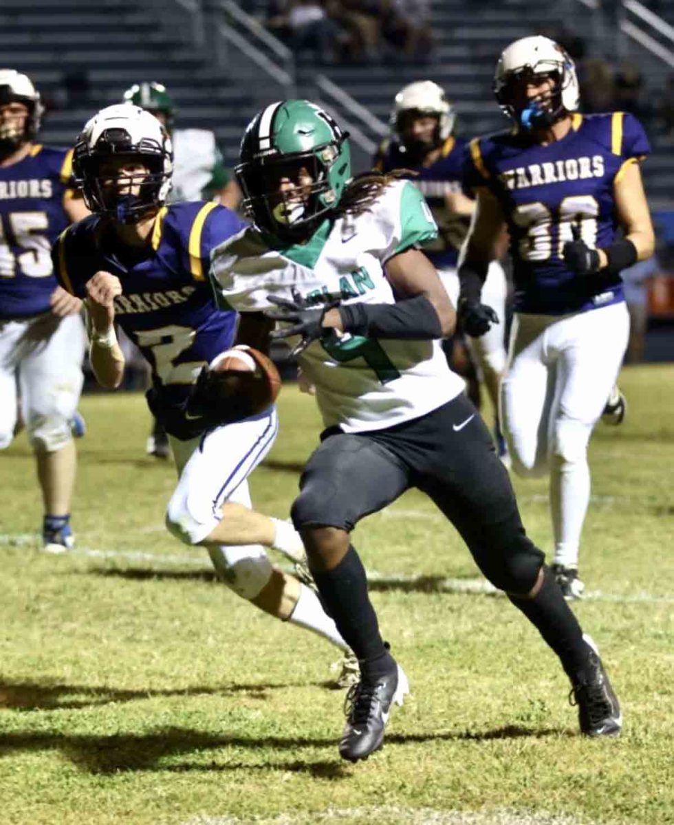 Harlan junior tailback Sedrick Washington broke free for a big gain in Friday's game at East Ridge. The Warriors scored a late touchdown to win 26-22.