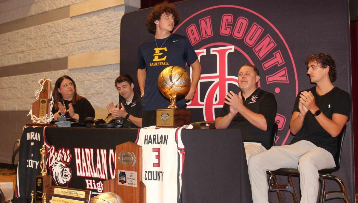 Harlan County senior guard Maddox Huff announced Friday at HCHS that he would continue his basketball and academic career at East Tennessee State University. Huff is pictured with his parents, LeAnne and Lonnie, and his brothers, Cameron and Jackson.