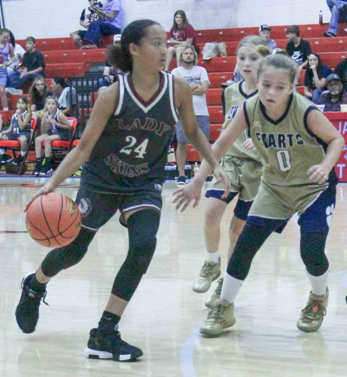 Cumberland guard Torrie Sundy worked against Evarts' Macy Middleton in county tournament action Saturday. Sundy scored nine points to lead the Lady Skins, but Evarts advanced with an 18-15 victory.