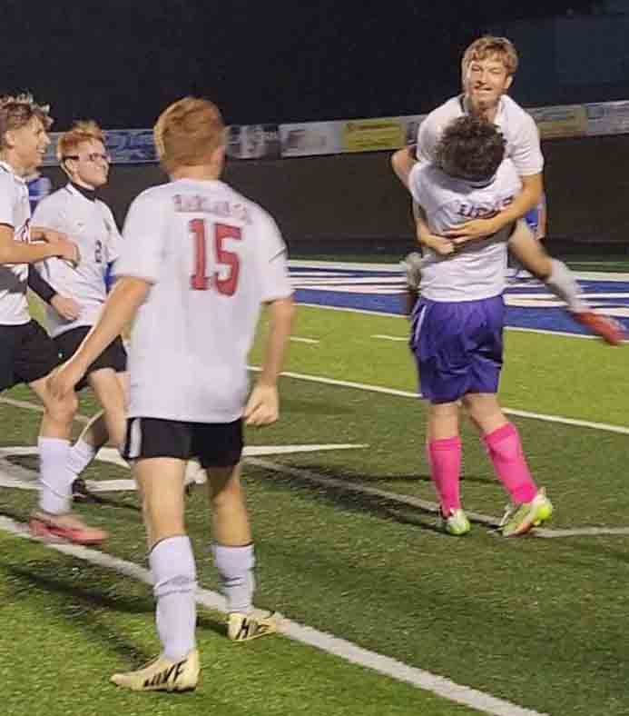 Harlan County's Josh Rigney was congratulated by teammates after he scored a goal in the Black Bears' win over Shelby Valley.