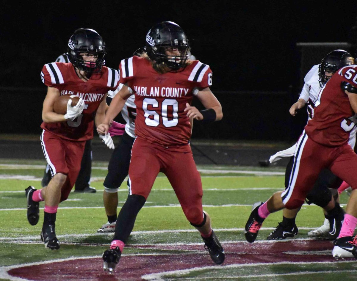 Harlan County junior Gage Bailey looked for running room in Friday's game against South Laurel. The visiting Cardinals overcame a slow start to win 29-15.