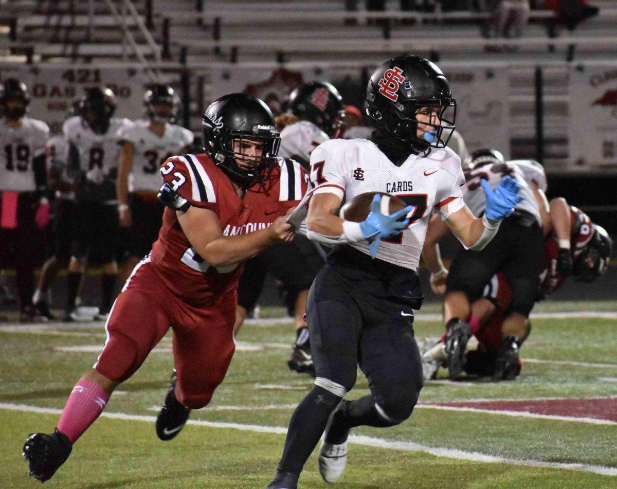 Harlan County freshman Sam Carr brought down South Laurel's Waylon Hensley in Friday's game. 