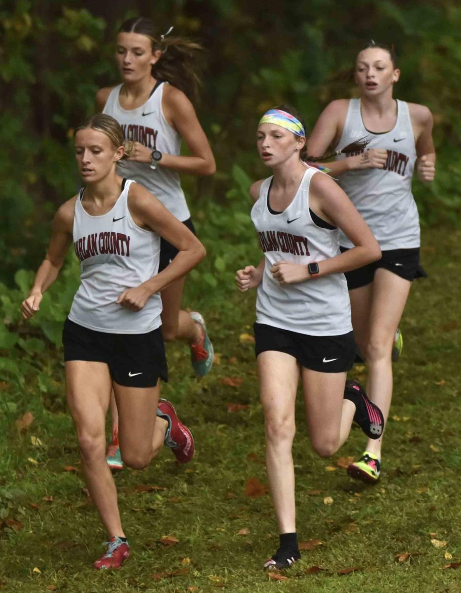 Harlan County runners Peyton Lunsford, Lauren Lewis, Gracie Roberts and Kiera Roberts took the top four spots in the Morgan County Sorghum Run.