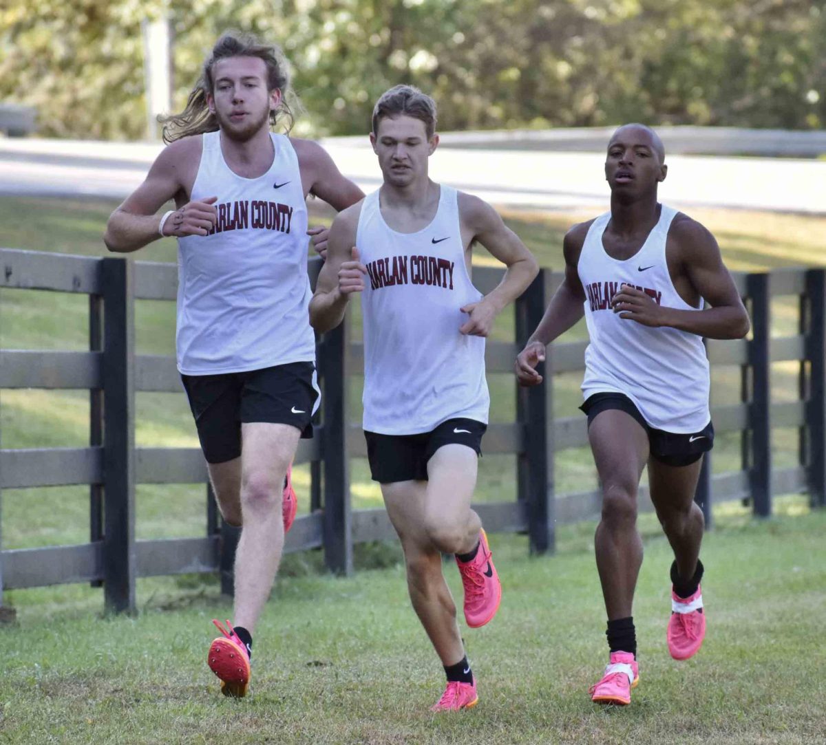 Kaden Boggs, Elijah Moore and Jacob Schwenke helped lead the Harlan County boys to the team title Saturday.