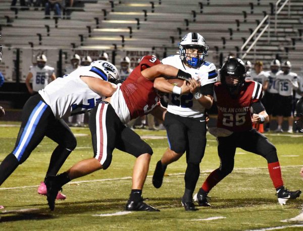 Bell County’s Kaleb Miller ran through the Harlan County defense in the Bobcats’ 52-14 win Thursday at Harlan County. Miler scored one touchdown on a pass and another on a run while adding four two-point conversions.