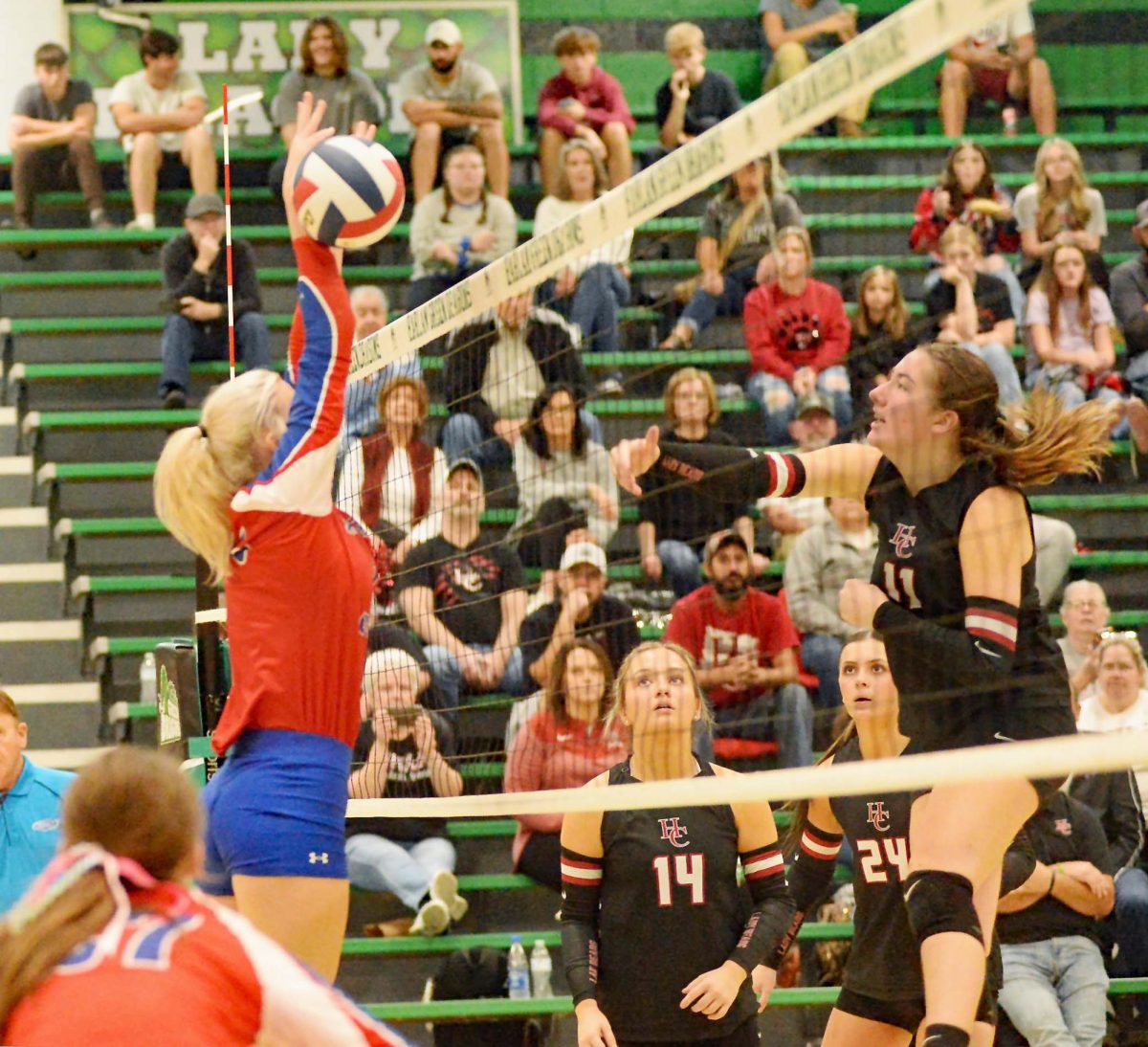 Harlan County’s Kylee Hoiska went to the net to finish a point during the Lady Bears’ 25-20, 25-15, 25-22 win over Jackson County in the first round of the 13th Region Tournament.