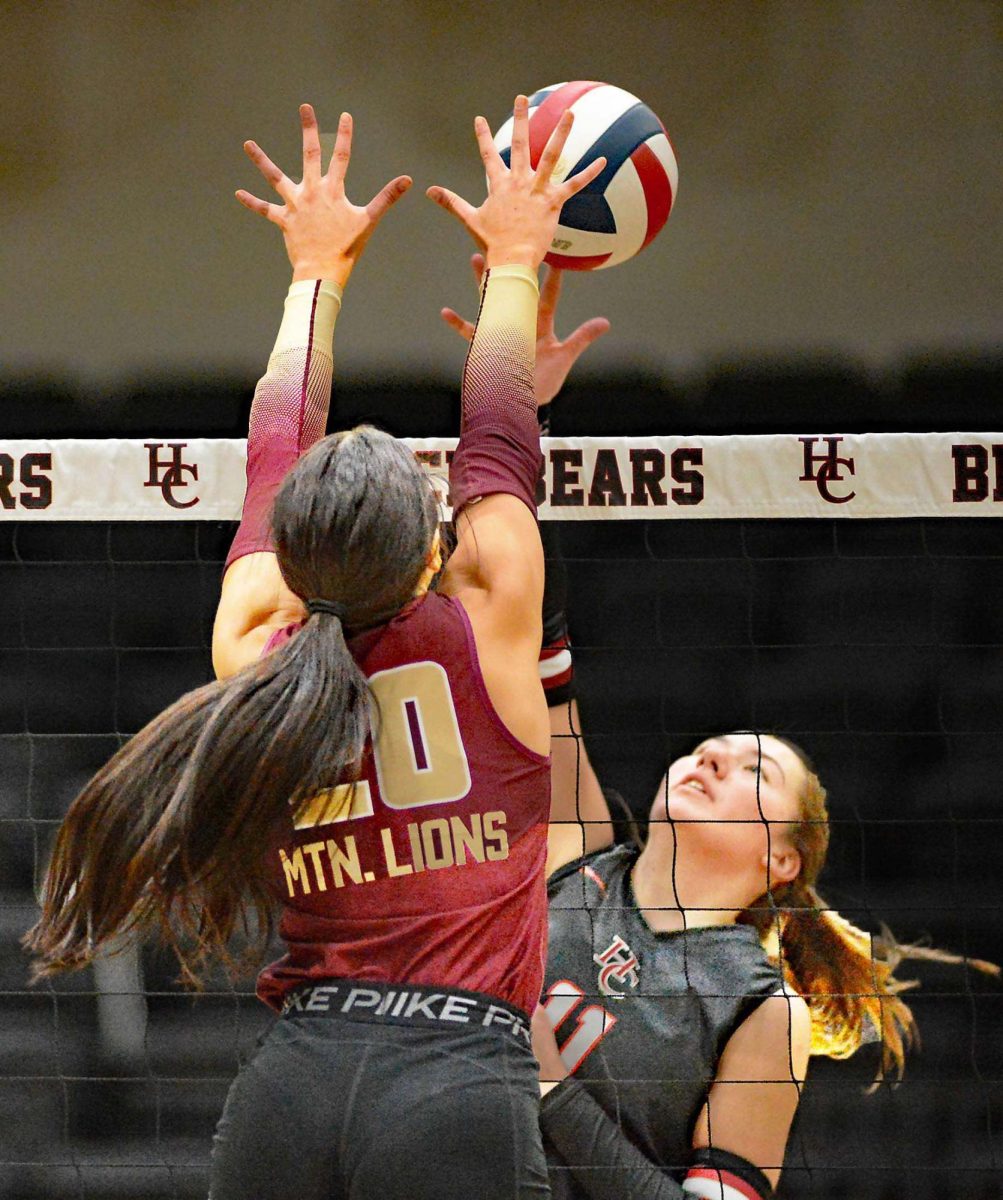 Pineville senior Ava Arnett and Harlan County junior Kylee Hoiska battled at the net in Thursday's match at HCHS. The Lady Bears won in three sets to set a county record for wins with 23. Pineville also has 23 wins on the season and set a school record earlier.