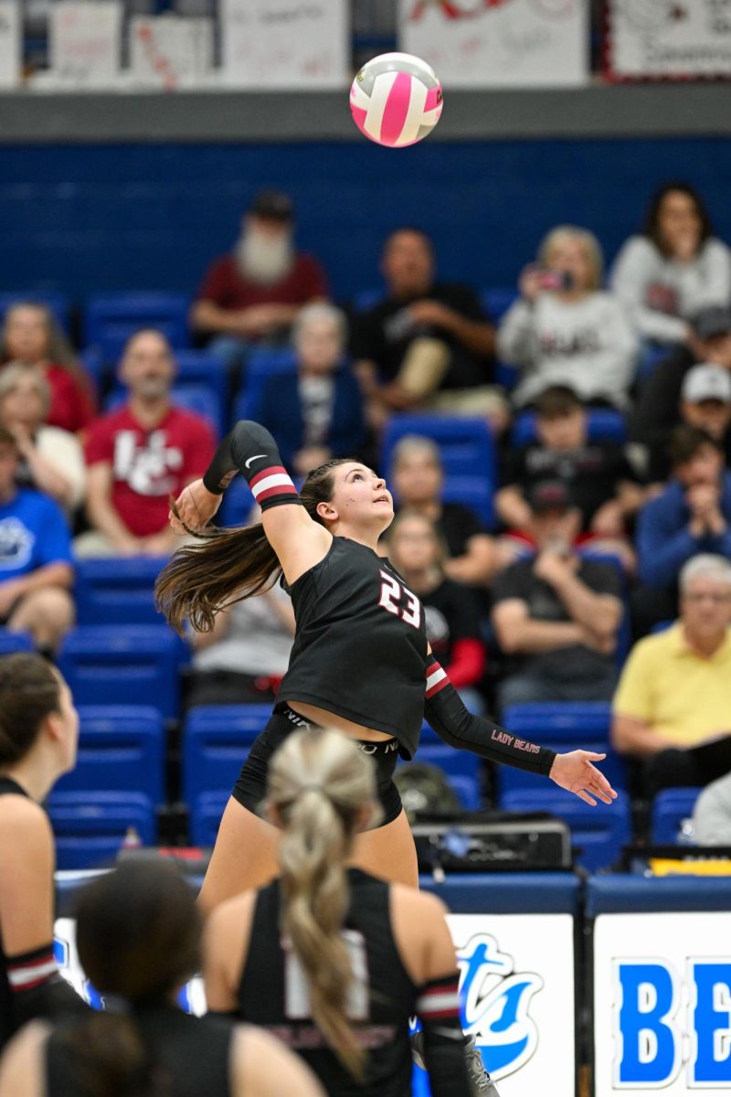 Harlan County's Ashton Evans went up for a return in district tournament action Monday against Harlan.