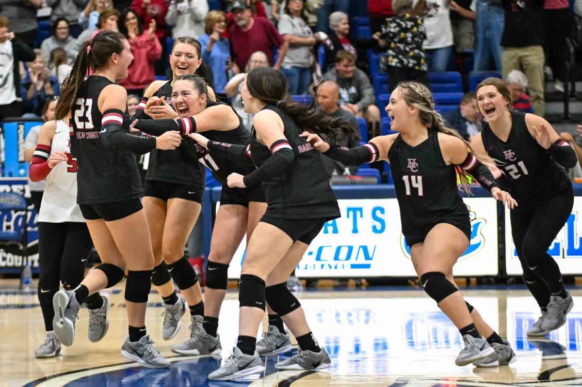 The Harlan County Lady Bears celebrated after closing out a four-set win over Bell County in the 52nd DIstrict Tournament finals Tuesday.