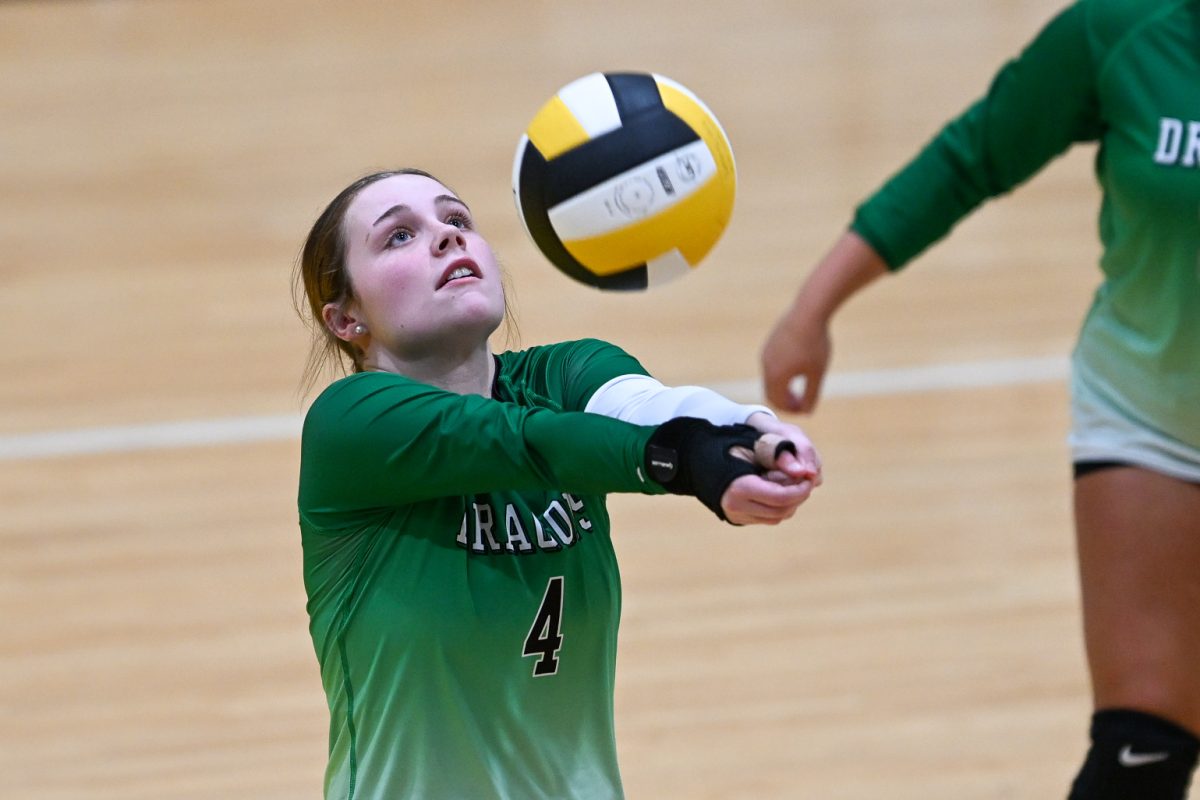 Harlan senior Kamryn Blanton set the ball in action earlier this season. The Lady Dragons will take on Harlan County in the 52nd District Tournament on Monday at Bell County.