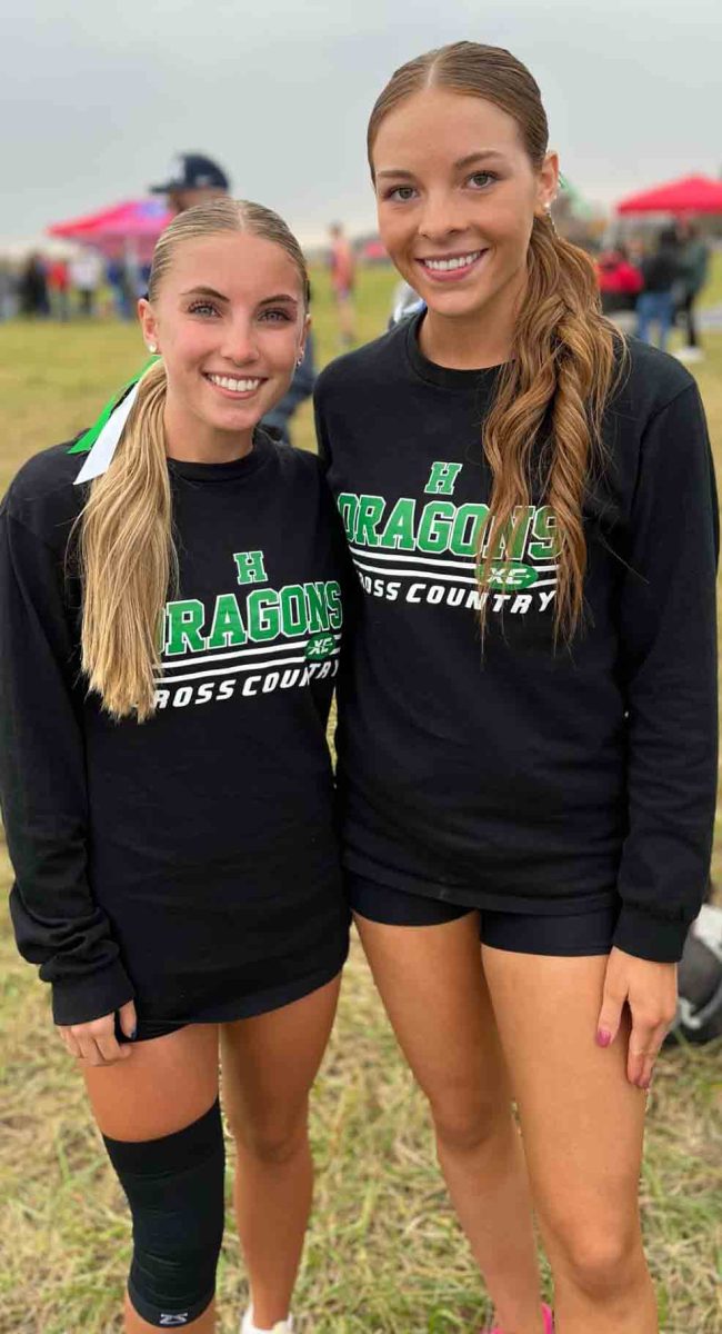 Ella Farley (left) and Abbie Jones are the seniors on this year's Harlan cross country team.