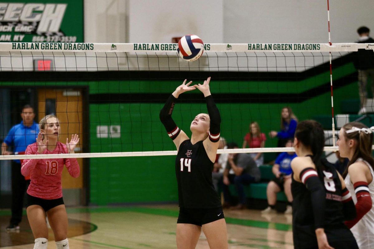 Harlan County's Savannah Hill set the ball in regional tournament action Monday.