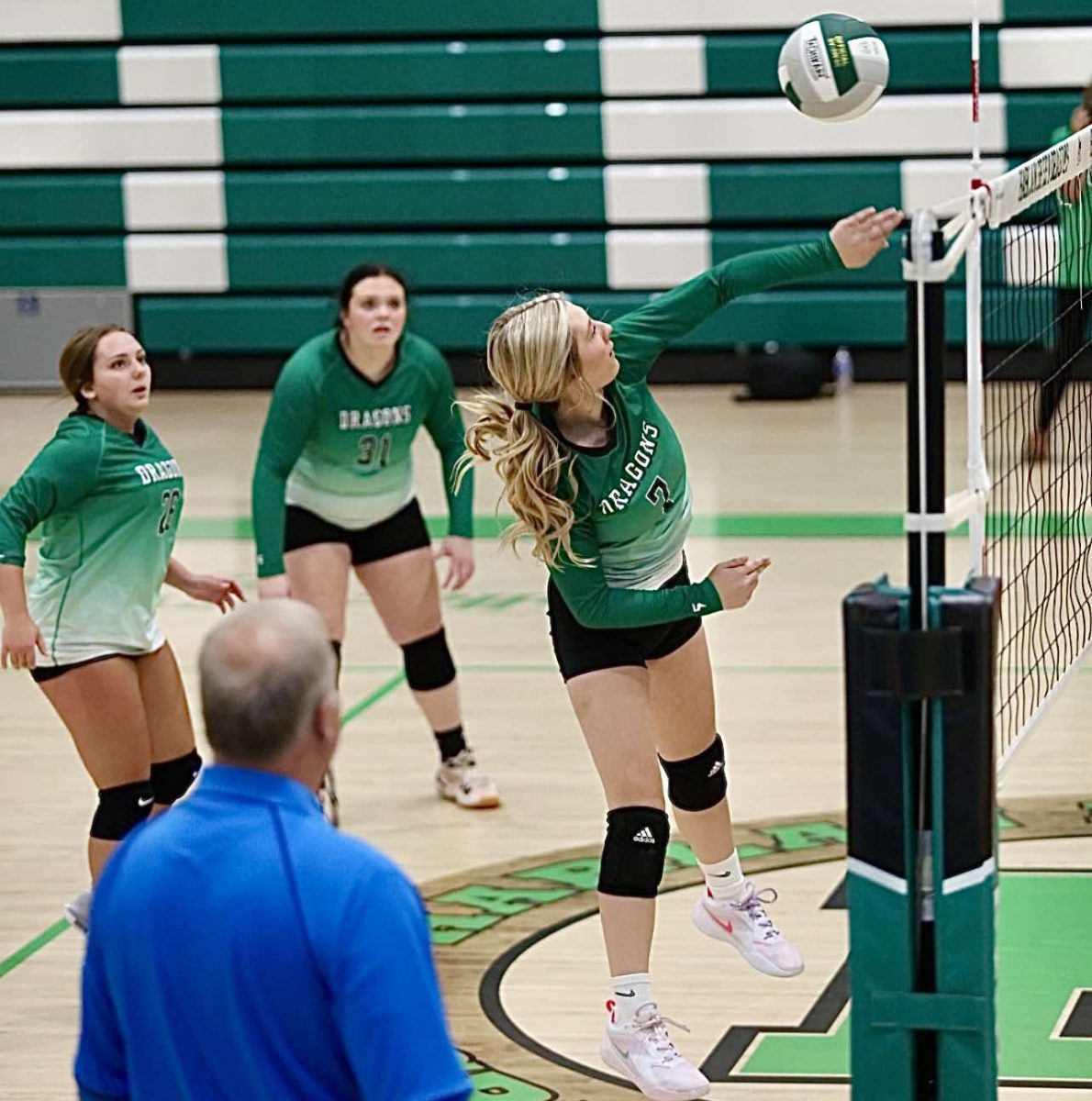 Harlan senior Kaylee Roark returned the ball in action earlier this season. The Lady Dragons closed the regular season with wins over Red Bird and June Buchanan.