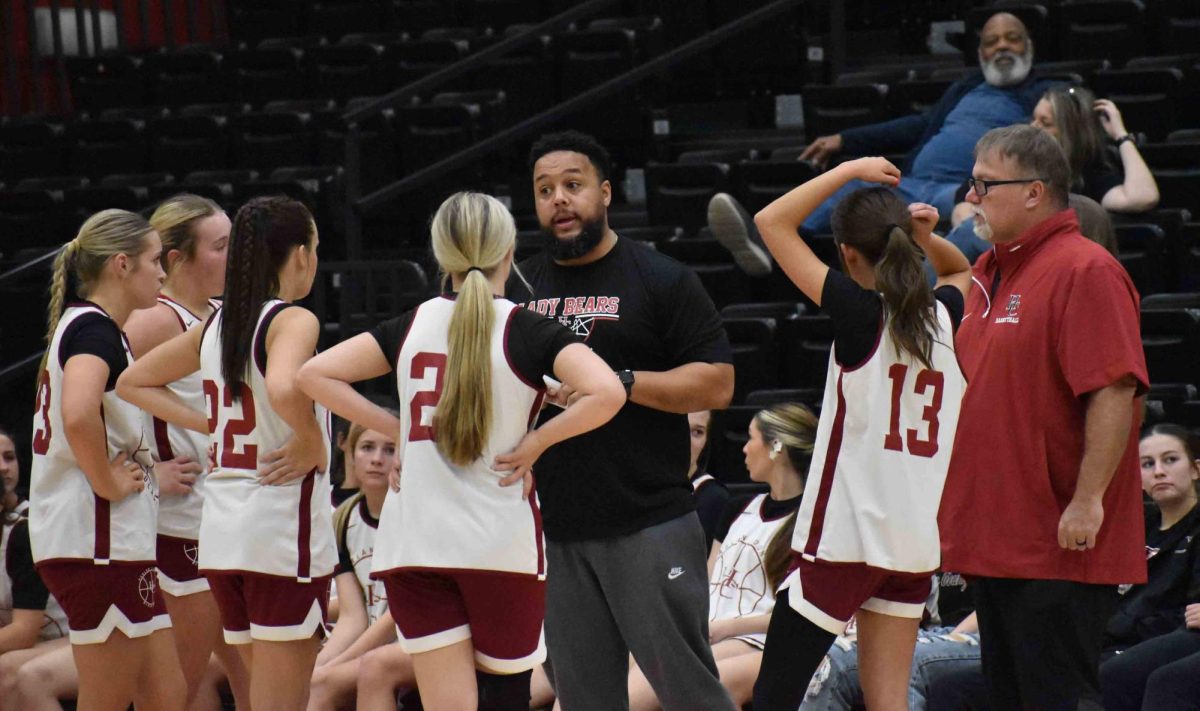 Harlan County coach Gary Greer talked to the Lady Bears during a timeout in scrimmage action Monday against North Laurel. The visiting Lady Jaguars coasted to a 56-22 victory.