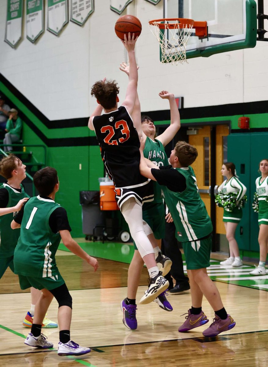 Lynn Camp guard Donovan Allen was surrounded by Green Dragons on Thursday in the visiting Wildcats' win at Harlan.