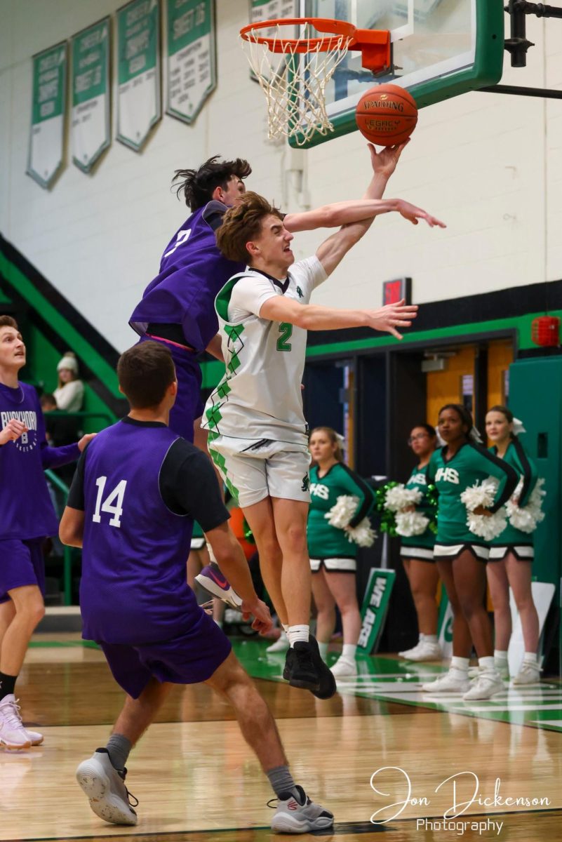 Harlan freshman guard Jaxson Perry drew a foul on a drive in scrimmage action Saturday against Buckhorn. Perry scored eight points in the Dragons' 88-65 victory.