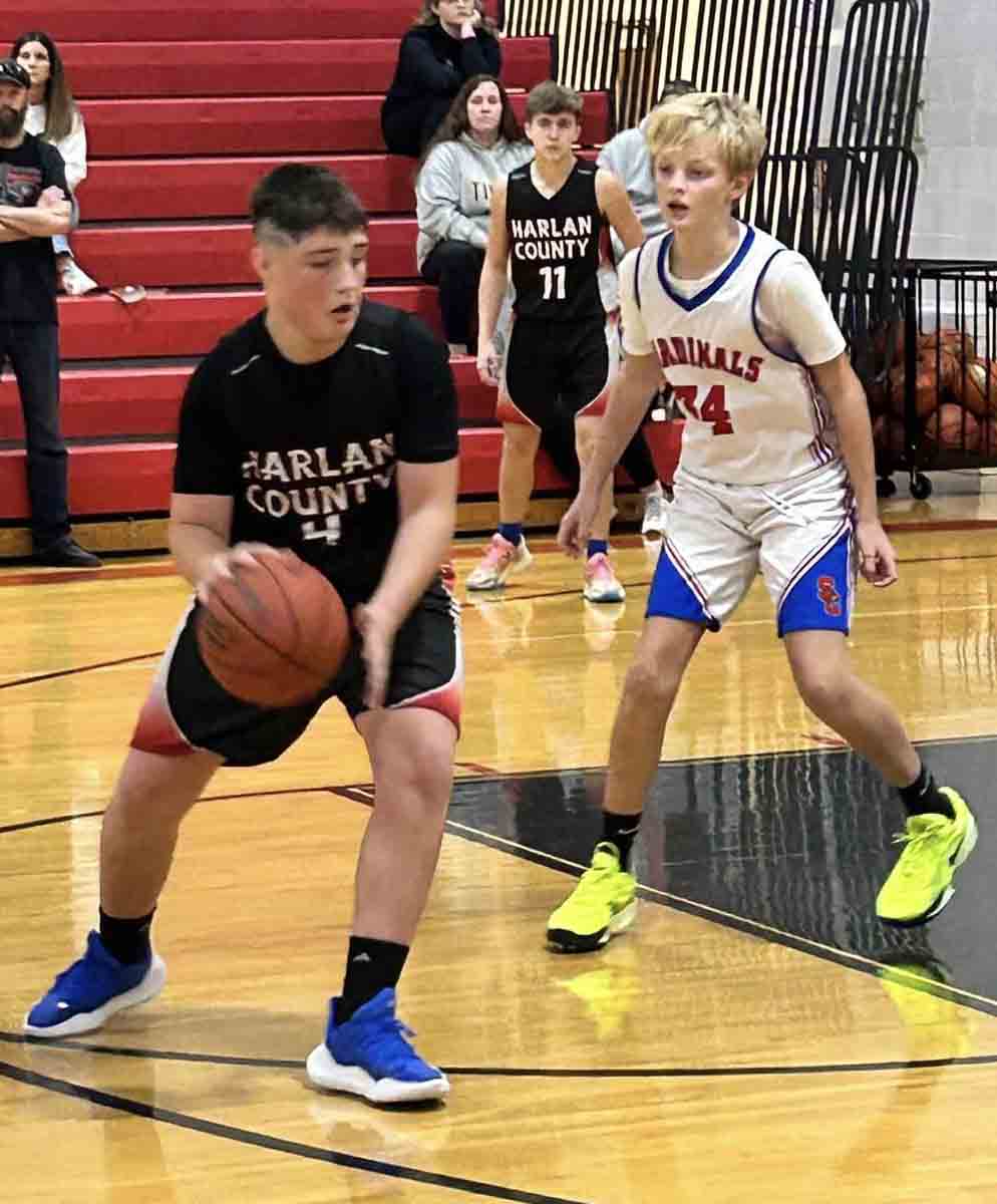 Harlan County forward Carson Sanders worked toward the basket during a victory Saturday over Scott County in seventh-grade basketball action at South Laurel. The Black Bears opened the season with wins over South Laurel and Scott County.