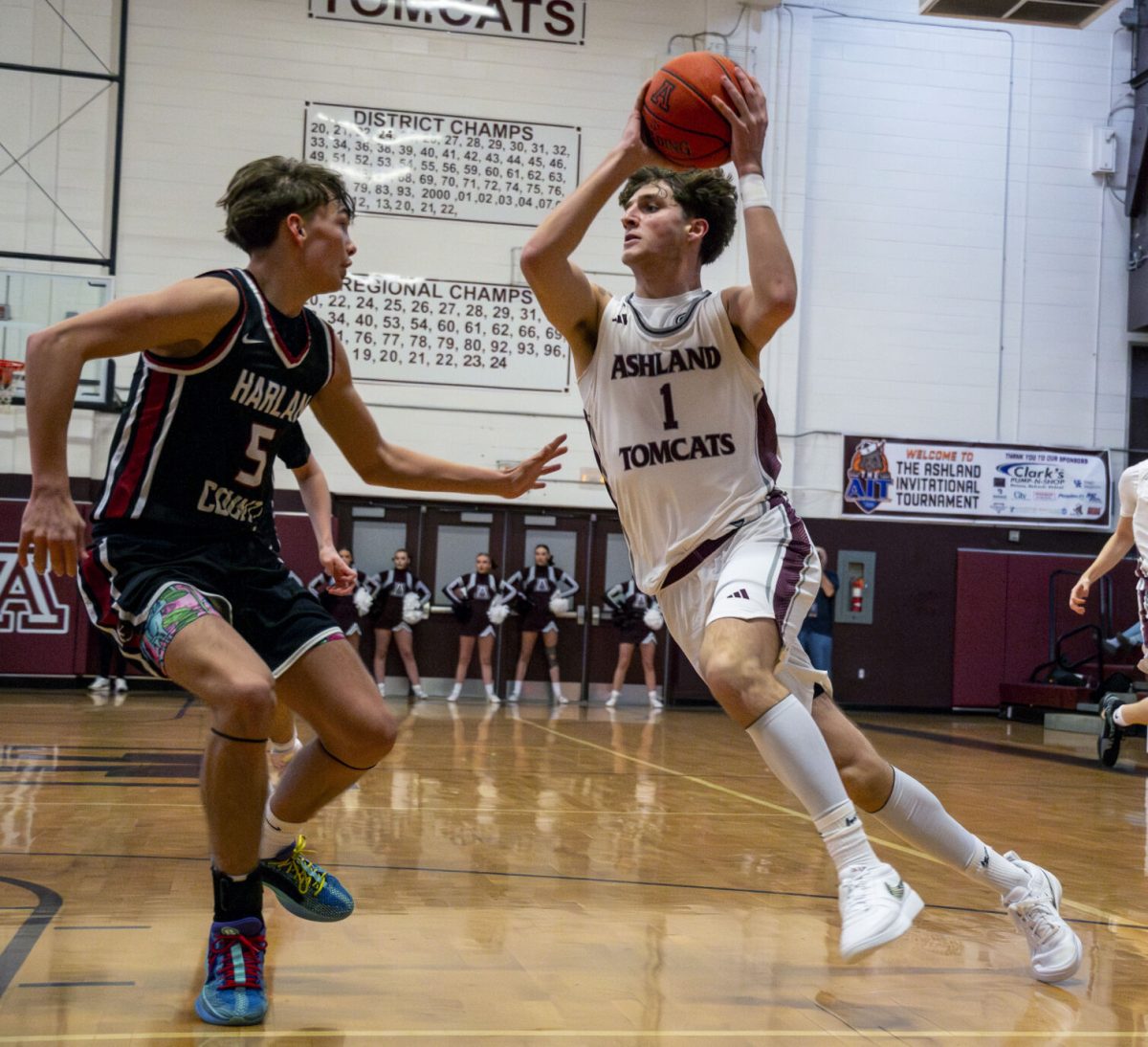 Ashland's Zander Carter (1) drove to the basket against Harlan County's Brennan Blevins (5) during the Ashland Invitational Tournament semifinals on Saturday.