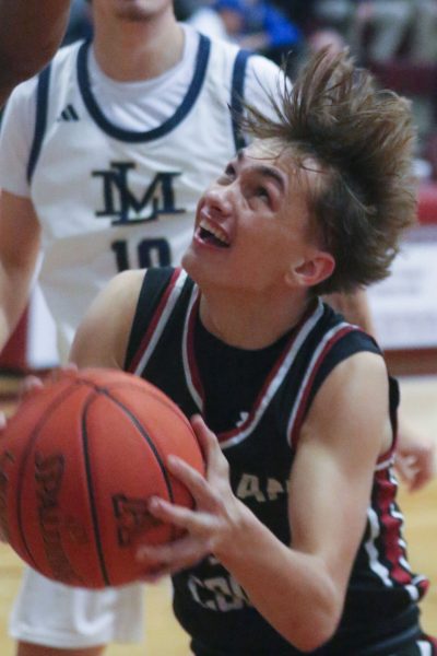 Harlan County guard Brennan Blevins worked inside for a shot in action from the Ashland Invitational Tournament.