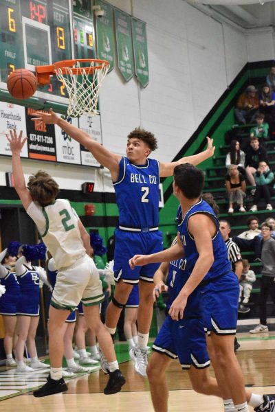 Bell County's Braxton Ferguson went after a shot by Harlan guard Jaxson Perry in Tuesday's game. The Bobcats pulled away in the second half for a 76-41 win.