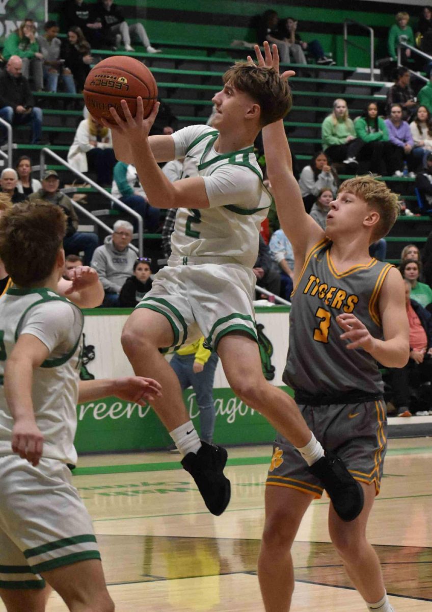 Harlan guard Jaxson Perry, pictured in action earlier this season, scored 22 points Sunday to lead the Dragons in an 85-71 loss to Powell County.