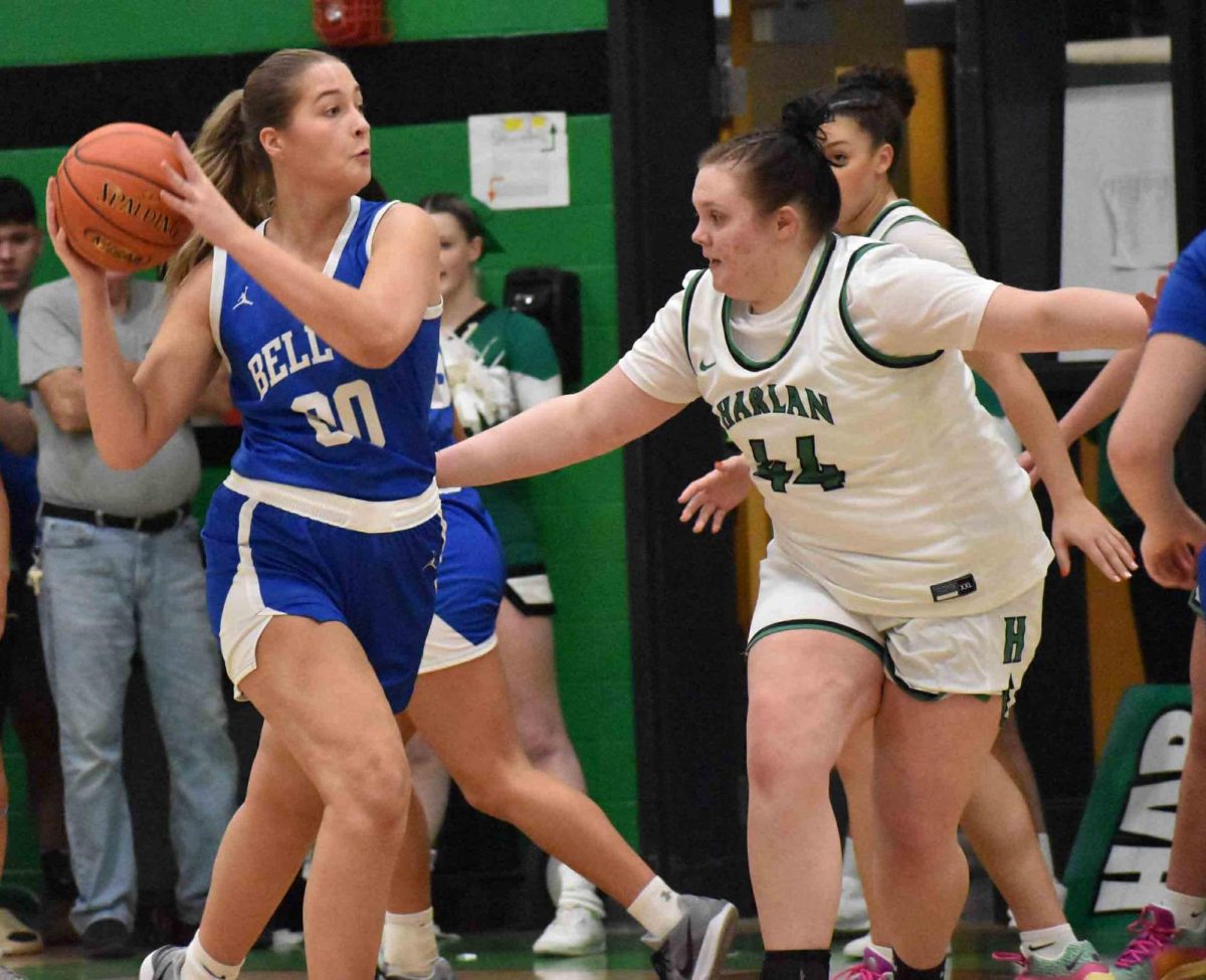 Bell County junior center Kairi Lamb worked against Harlan's Abbi Fields in a district clash Tuesday. Lamb finished with 22 points and 18 rebounds in Bell's 55-50 win.