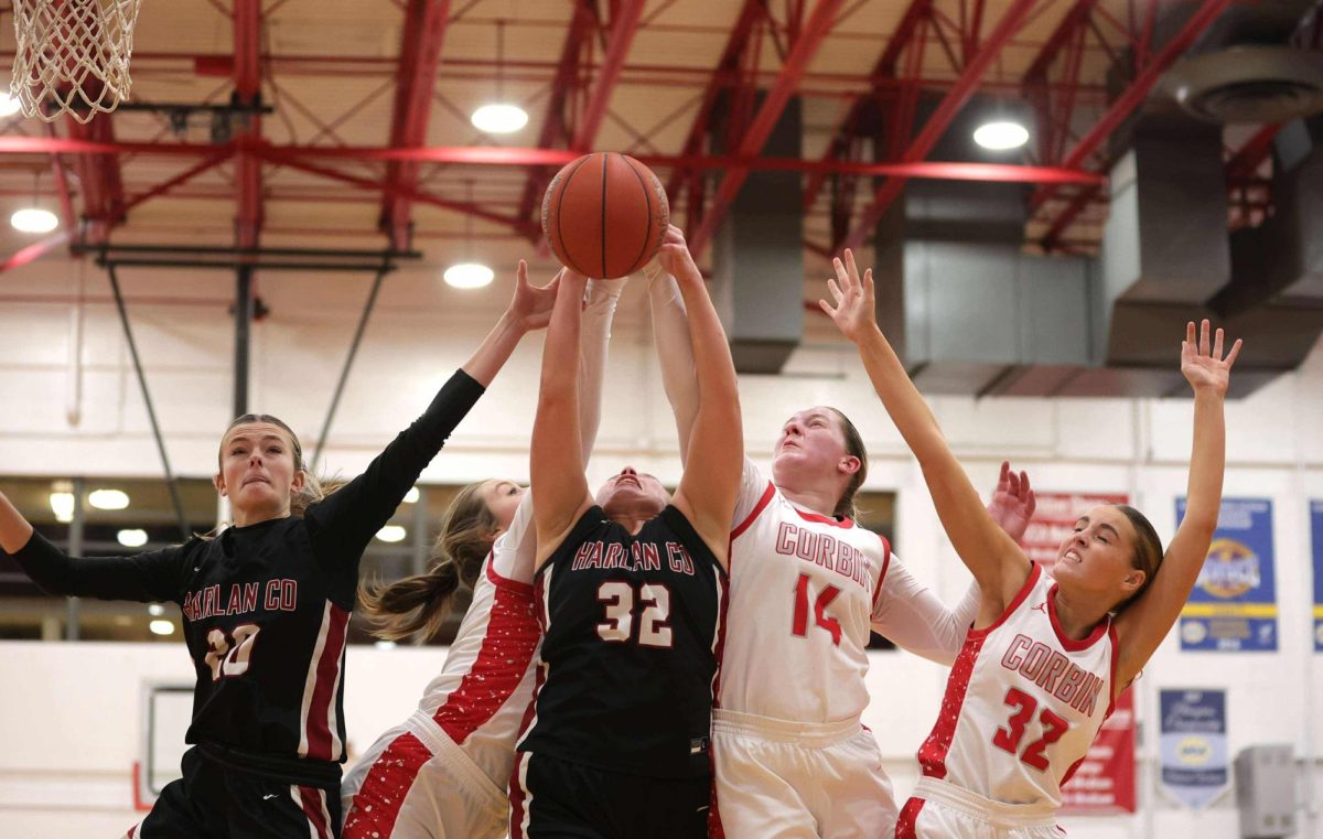 Harlan County junior center Lacey Robinson battled for a rebound in action earlier this season. The Lady Bears fell to Baylor School, Tenn., and Pineville action this week at the Smoky Mountain Christmas Classic.